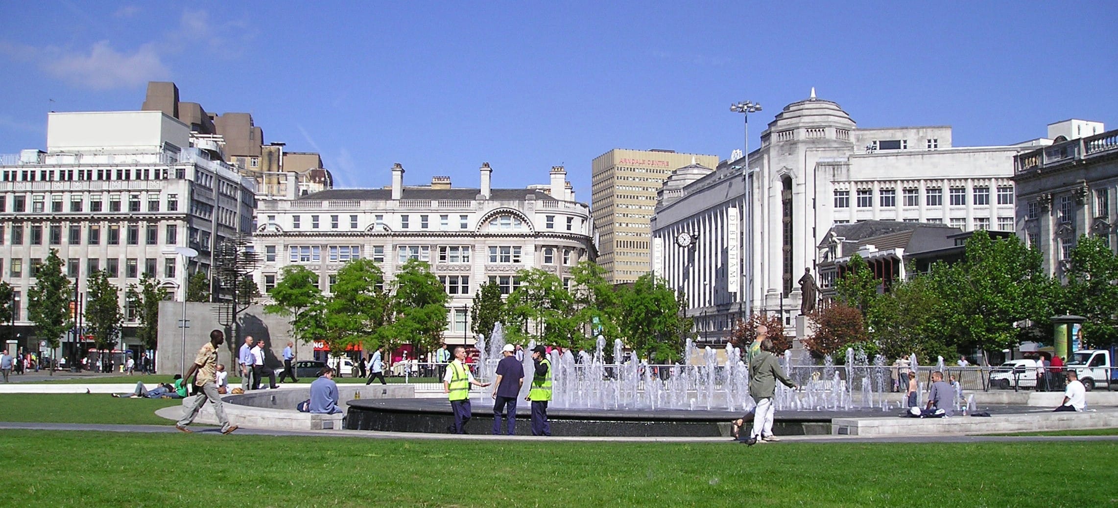 MC Academy UK. this image contains university whole ground view from lawn at noon.