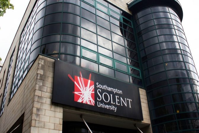 Solent University UK. images contains ground view of main entrance of university at dawn.